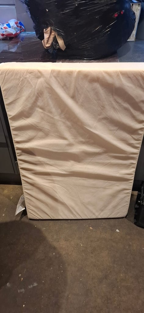 Travel cot with mattress and mattress topper 