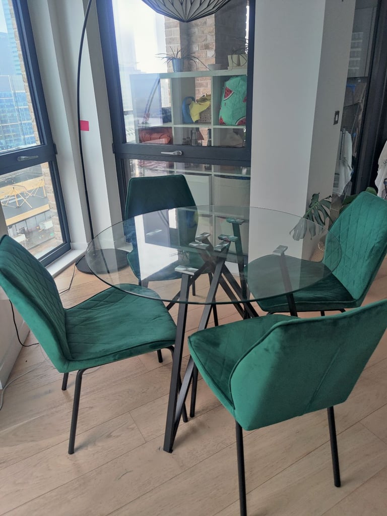 Glass table with four velvet chairs