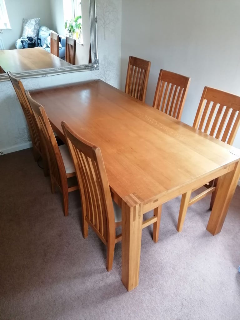 image for Solid oak dining table and 6 chairs 