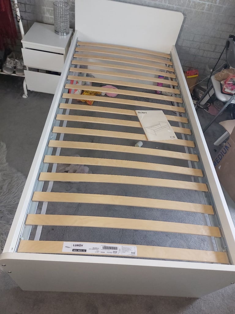 Single bed in white colour with bedside 