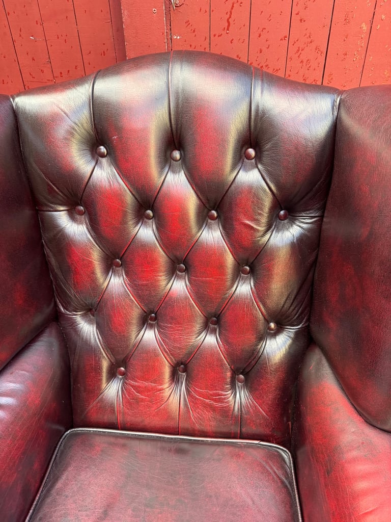 Chesterfield Leather wingback armchair and matching footstool