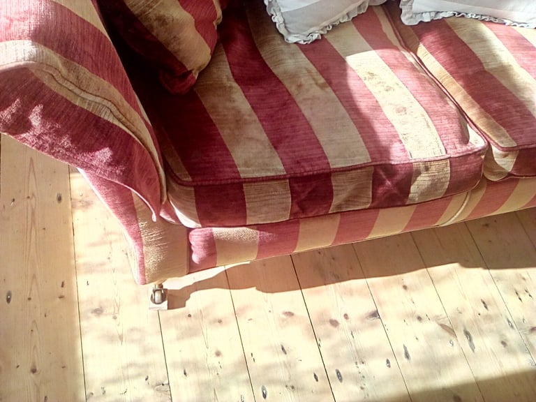 Red and gold striped sofa