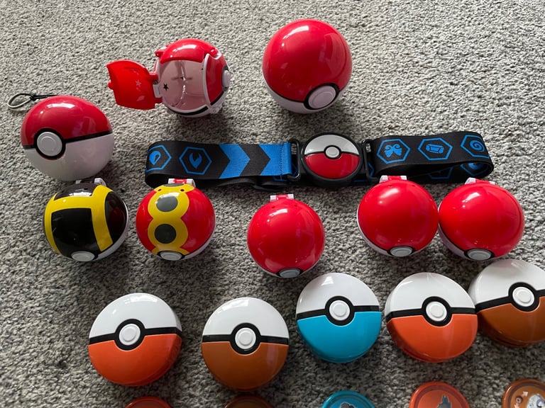 Job lot of pokemon balls figures belt disc launchers