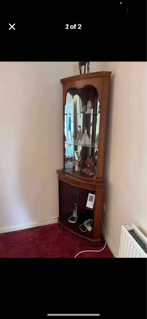 image for Elegant wooden corner display with glass shelves and a mirrored back 