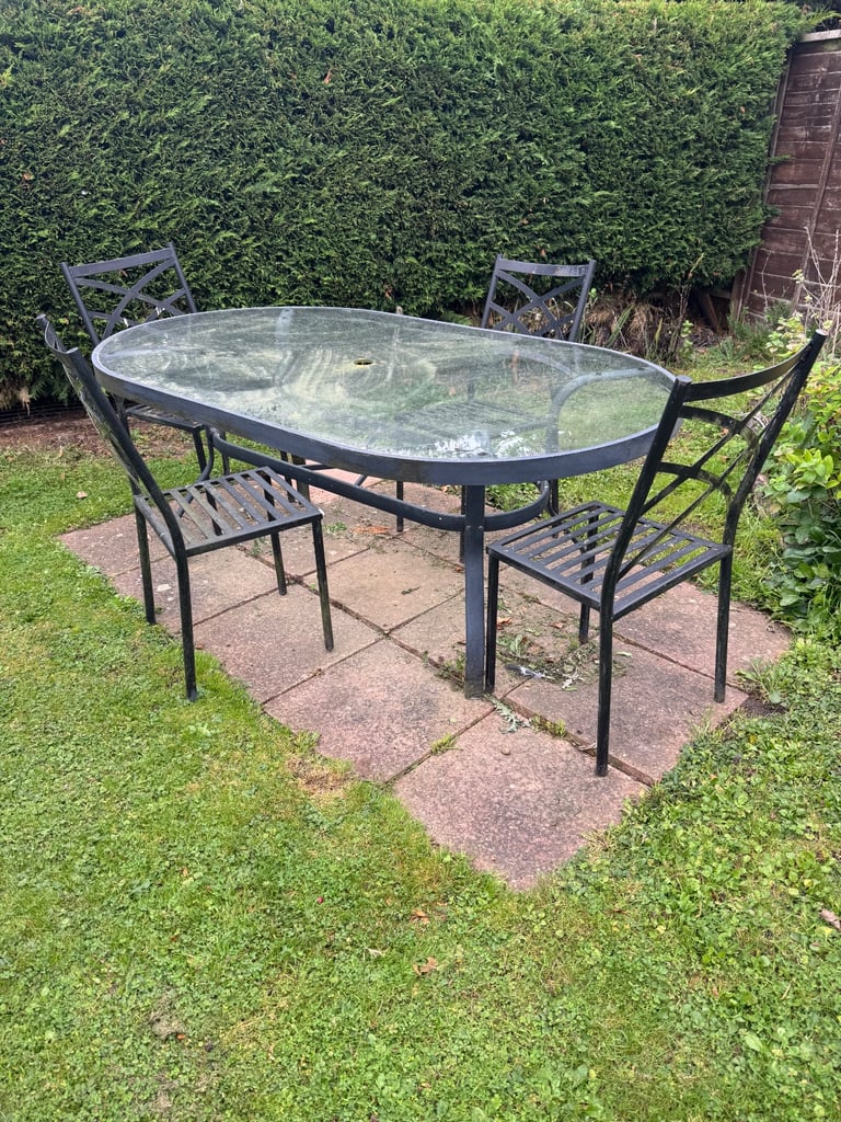 image for Free - Glass topped patio table and 4 chairs
