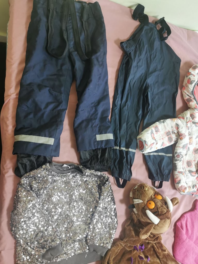 A set of clothes for a 5-6 year old girl. Most of the clothes are in good condition. 
