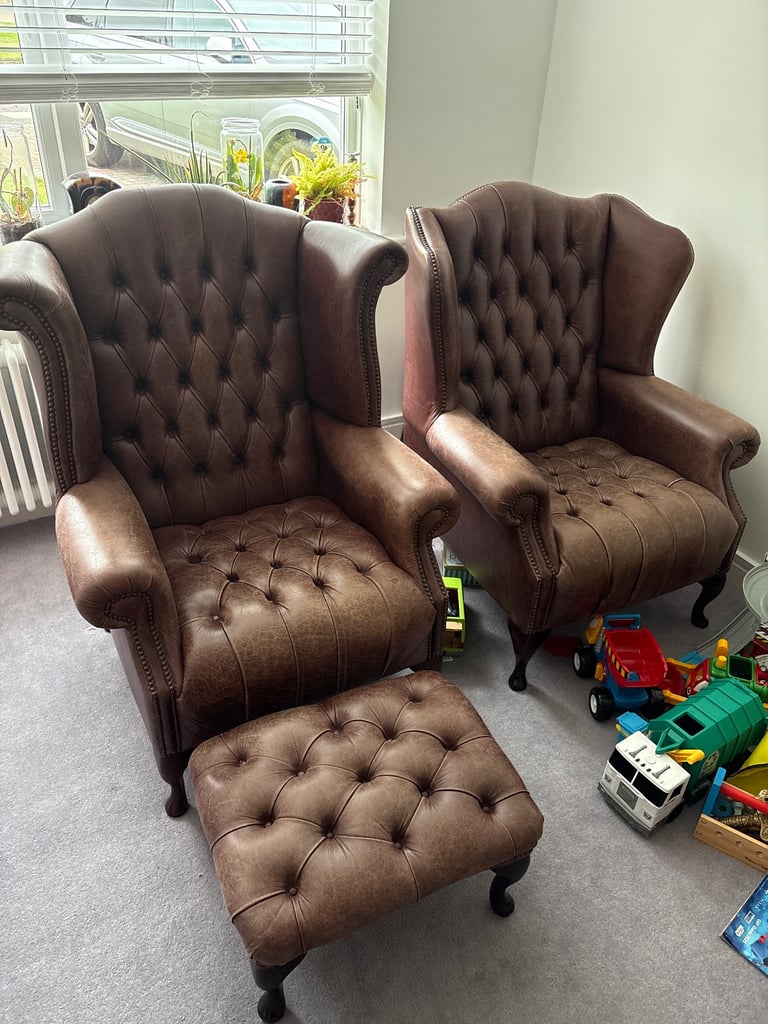 2 Saxon Leather Armchairs and 1 footstool 