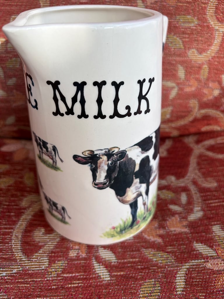 Ceramic milk jug with cow illustration
