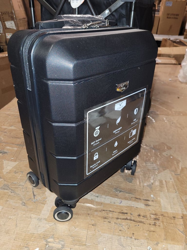 A new still boxed black 15inch  hard shell cabin bag suit case.