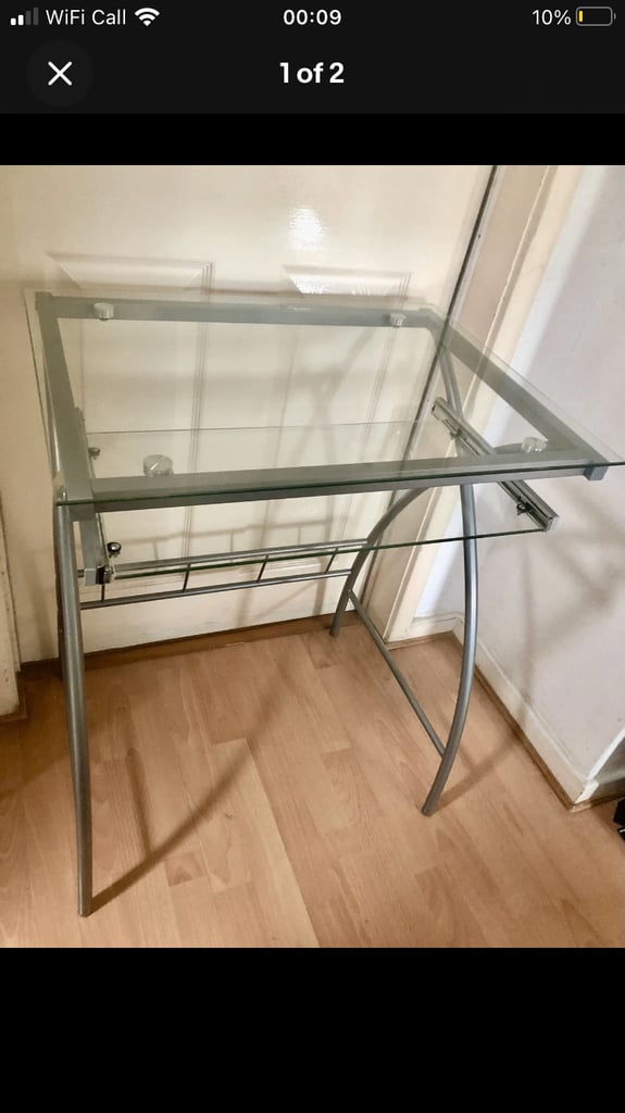 Glass computer desk with a sliding table 