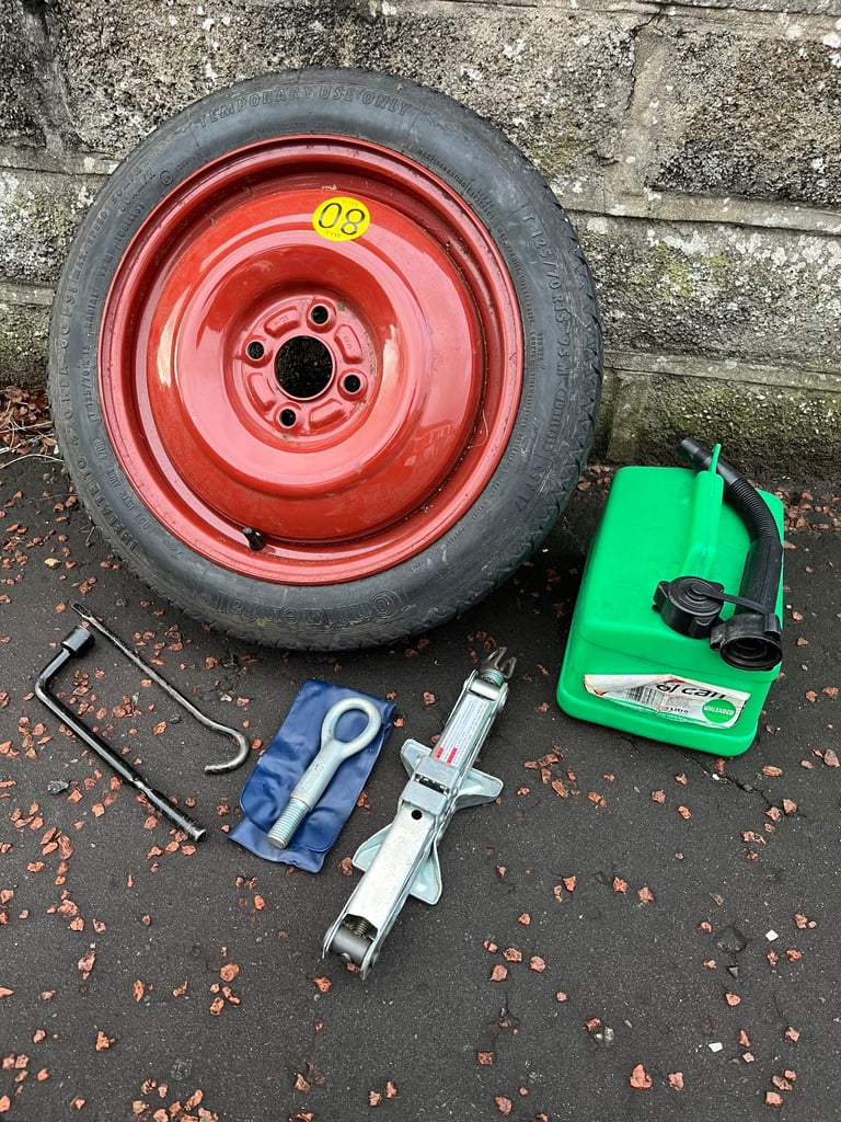 Suzuki swift space saver wheel, jack, tow hook and fuel can