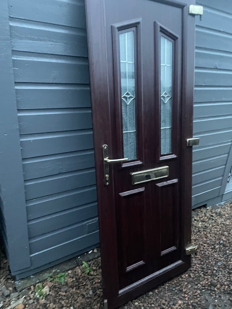 Upvc front door in rosewood 