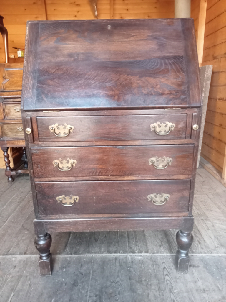 Oak three drawer fall front minister of food writing bureau with bulbous legs