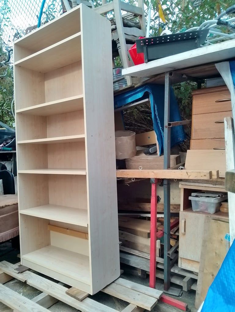 Very tall shelving unit in new condition spotlessly clean inside and out 