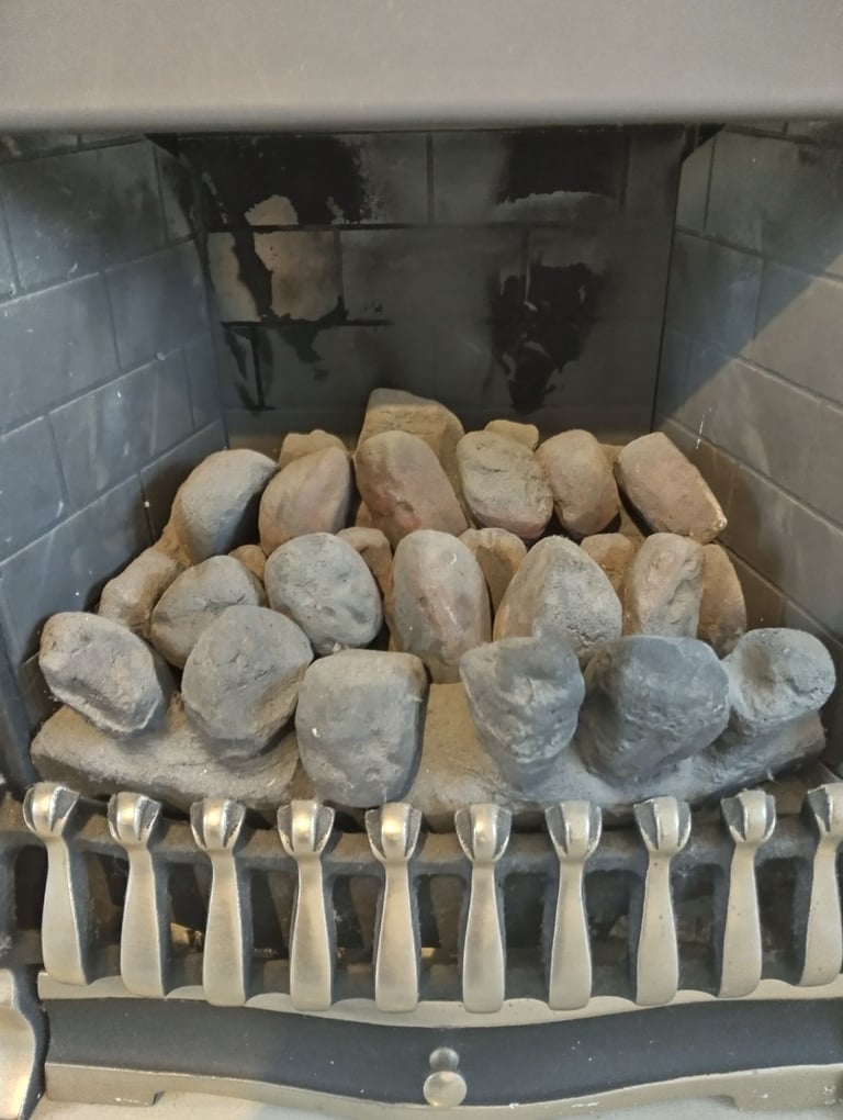 Gas fire with hearth and wood surround