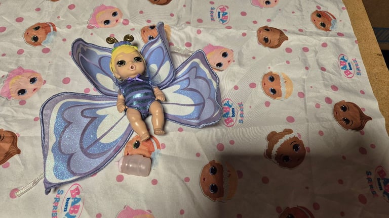 image for Babyborn suprise butterfly doll with bottle and wrap. Drinks and wees in her nappy. 