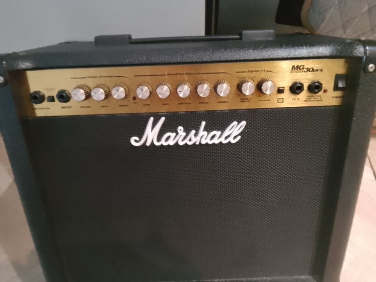Marshall MG30 DFX amp with a marshall Jackhammer peddle and 2 leads with headphones 