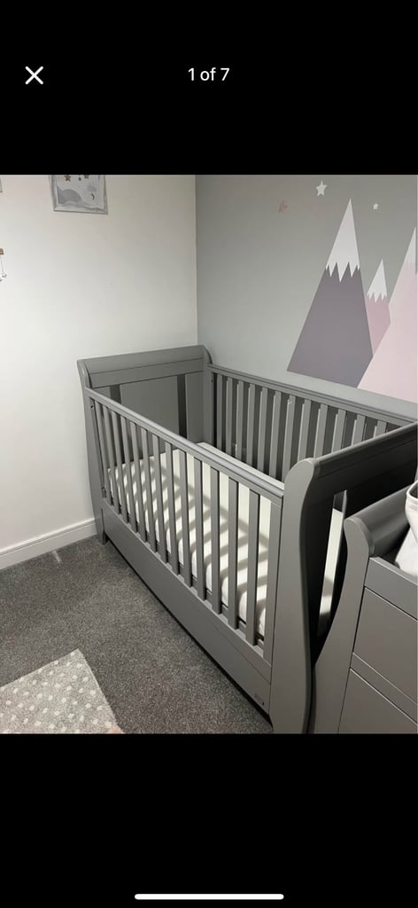 Grey cot bed with mattress available 