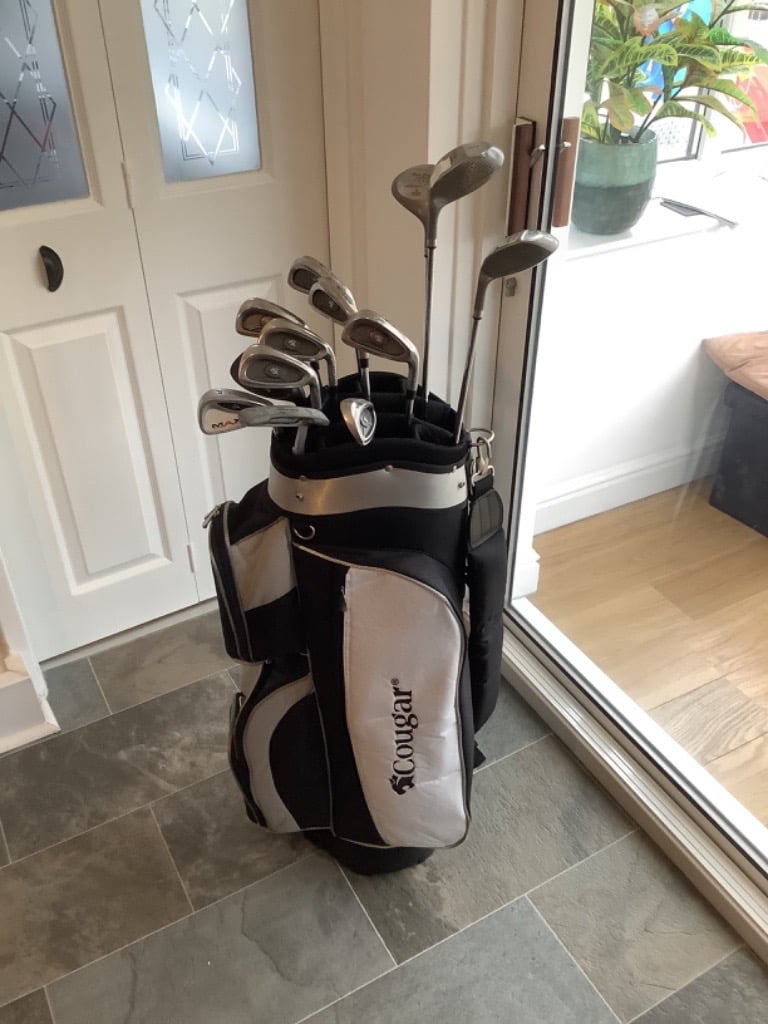 Complete set of Cougar golf clubs, in a lovely Cougar golf bag. in
