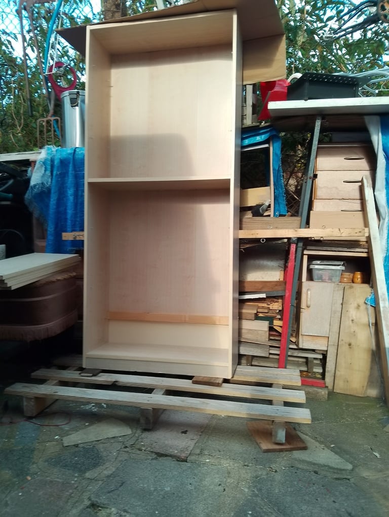 Very tall shelving unit in new condition spotlessly clean inside and out 