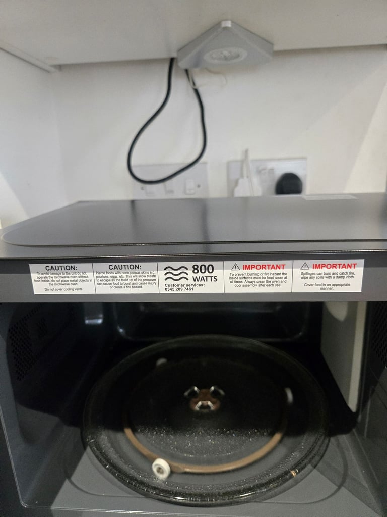 Brand new russell hobbs (rhm2060b) microwave with a small dent on the side (working perfectly)