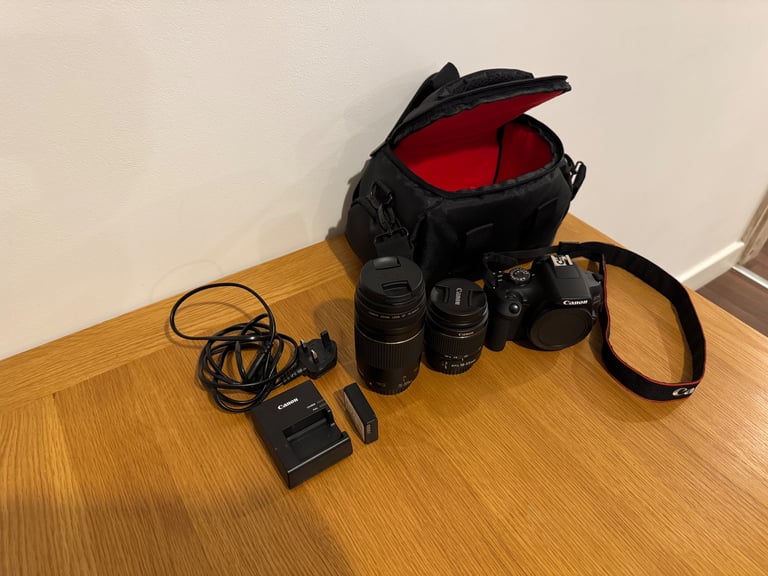Canon EOS 2000D DSLR camera with two canon lenses.