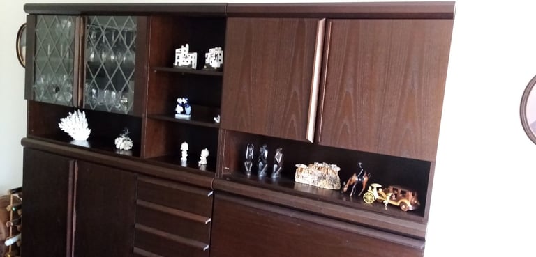 Dark brown storage/ display/ cocktail bar combination wall cabinet.