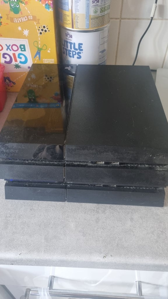 image for 2 ps4s both work no control pads 