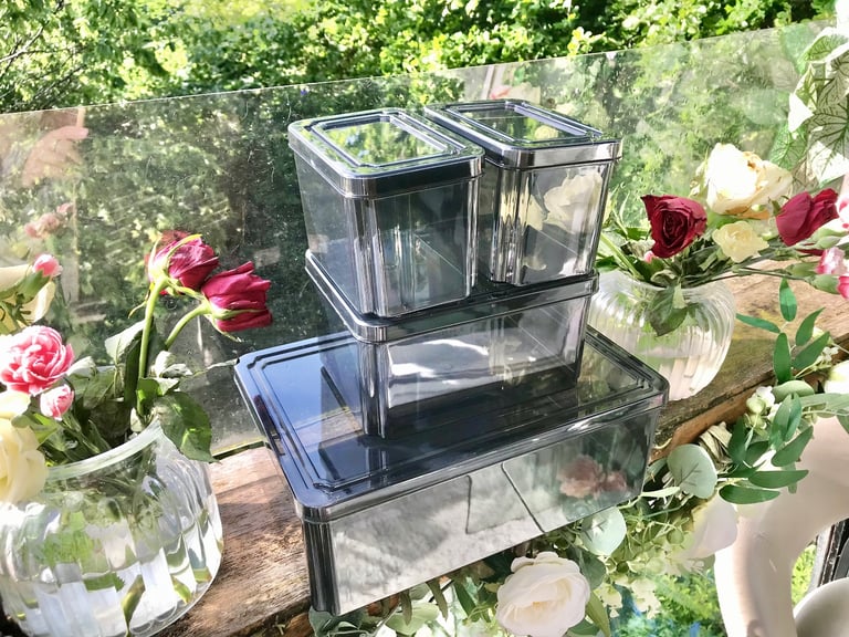 Good quality. Set of 4 Black tint plastic storage boxes Only used a few times