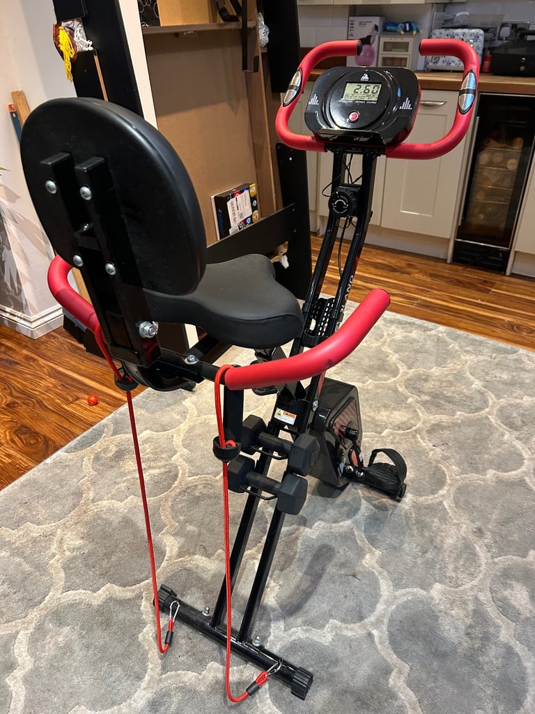 image for Exercise bike featuring resistance bands and digital display.