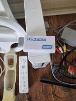 Nintendo Wii + Wii Fit + Games and more.