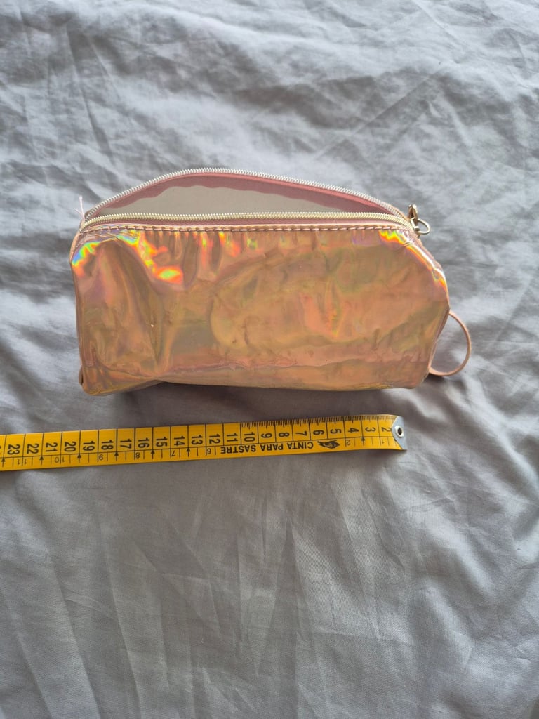 image for Gold-ish and trendy make up bag with ample space and hand holder