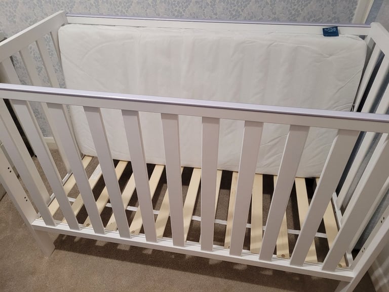 Hardly used Adjustable Cot/bed with Mattress 120 x 60cm