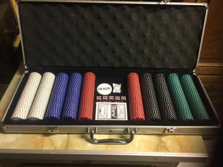 Poker chip’s set with dice and playing cards 