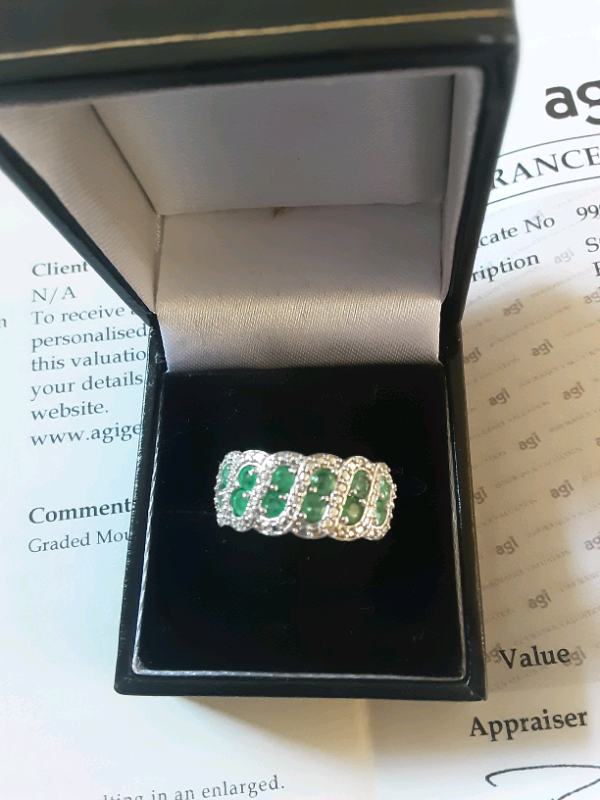 silver emerald ring, set with twelve round emeralds certificate for £290