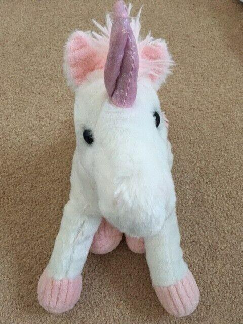 Plush unicorn soft cuddly toy in white and pink