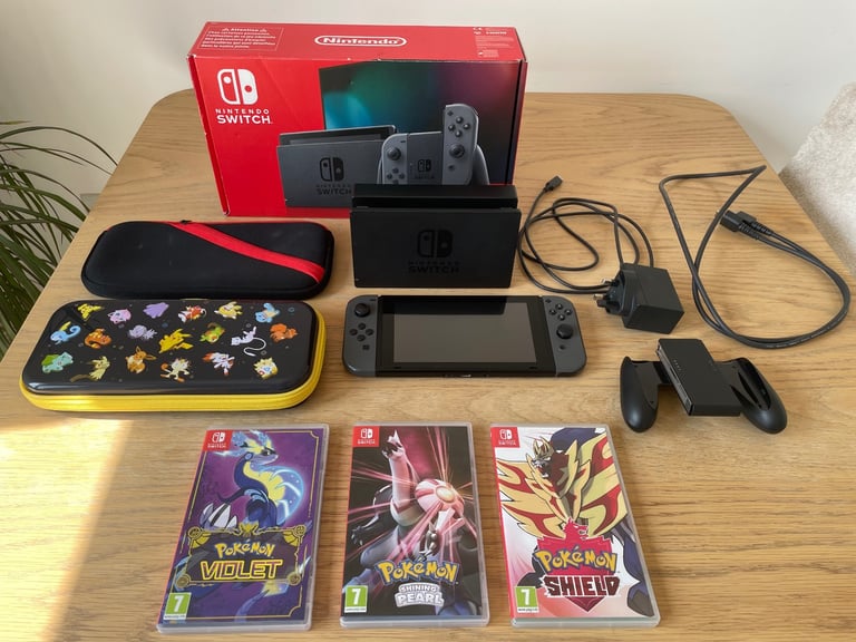 image for Nintendo Switch 32GB - Grey (Unboxed) with Joy-con Controller, 2 Official Cases and 3 Pokemon Titles