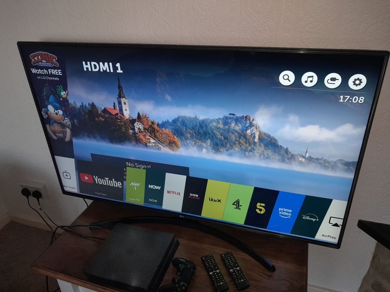 LG 55 inch 4K Ultra HD HDR Smart LED TV with two remotes
