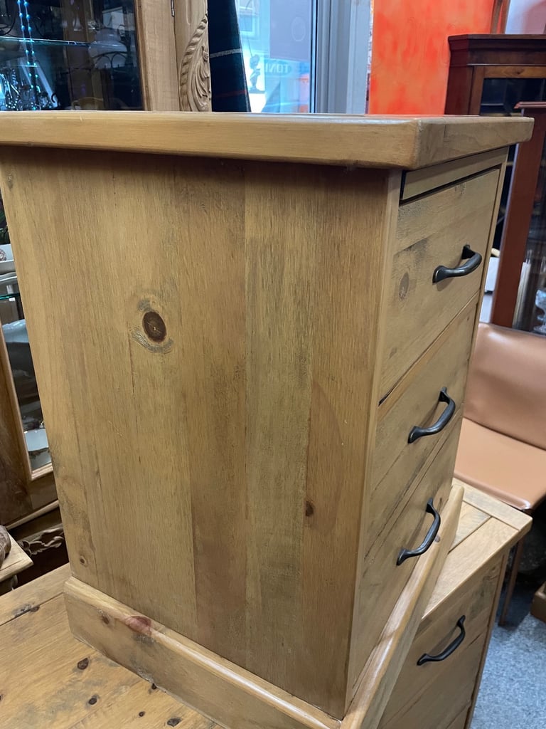 Two, solid wood bedside cabinets.