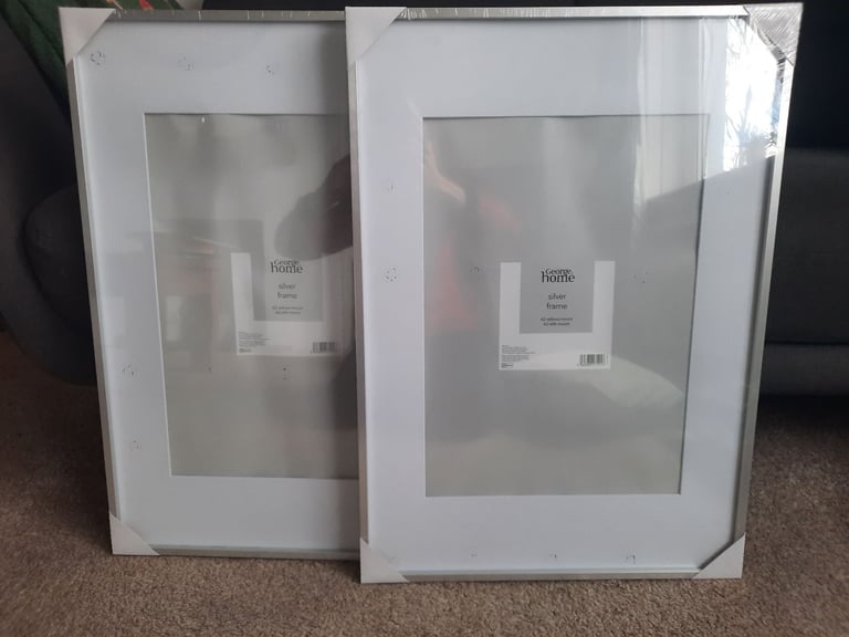 2 x Silver framed picture frames,  size A2 without mount, A3 with