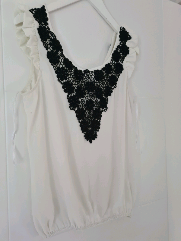 image for Blouse white and black...never useSmall sizeBlouse white and black..