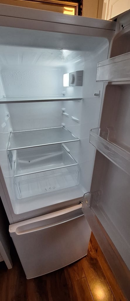 LOGIK fridge freezer size  H 142cm like new one year old 
