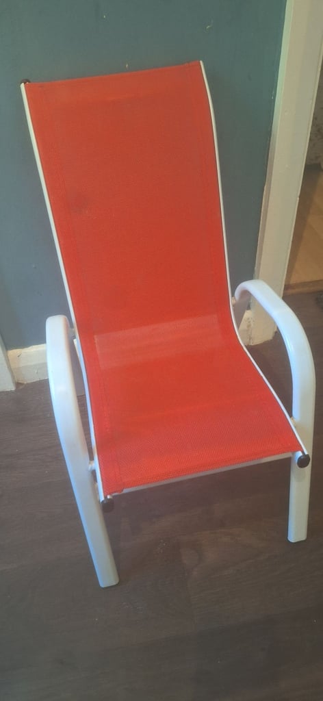 Pink kids table and red chair 