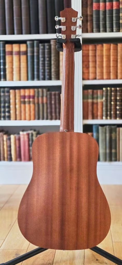 Taylor BT2 guitar with gig-bag in lovely condition with rich sound.