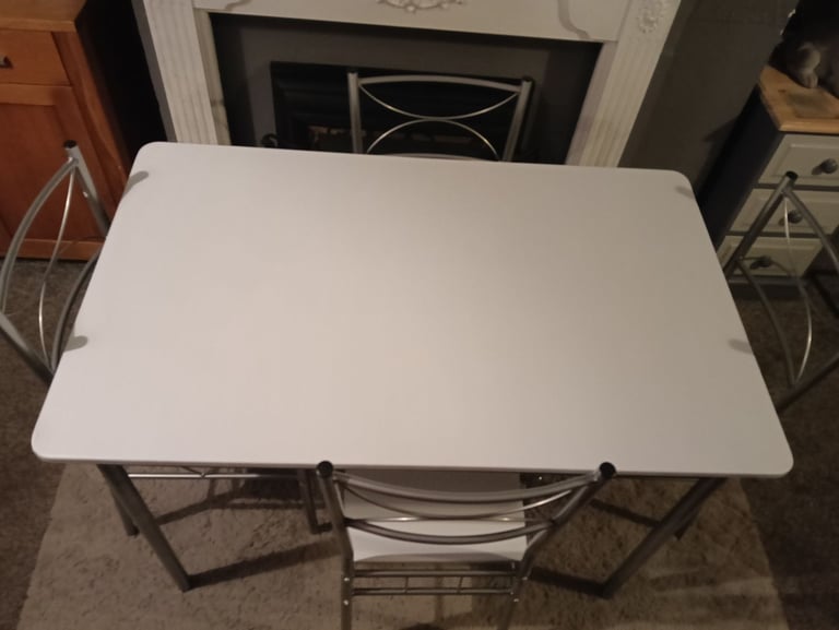 White dining table and four chairs feel free to contact me 