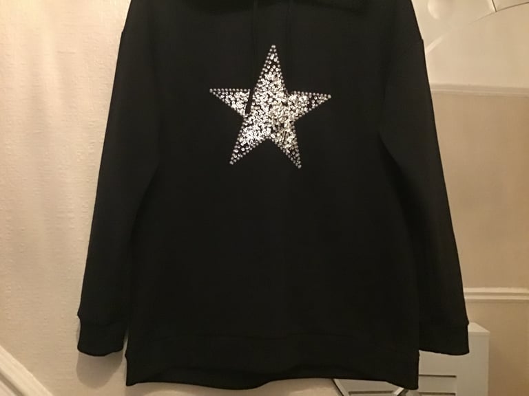 image for Black hooded sweatshirt with silver sequin star at the front