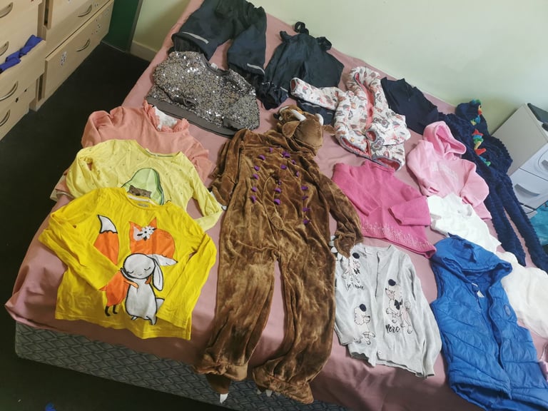 A set of clothes for a 5-6 year old girl. Most of the clothes are in good condition. 