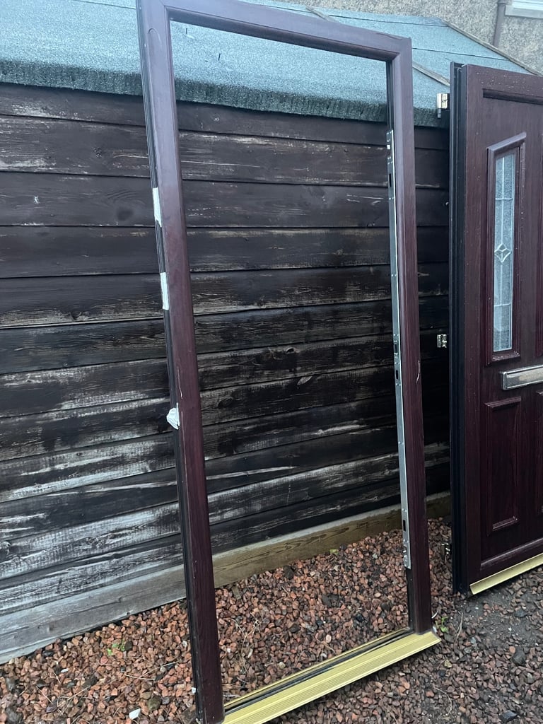 Upvc front door in rosewood 