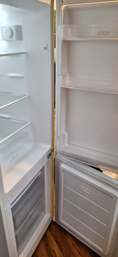 LOGIK fridge freezer size  H 142cm like new one year old 