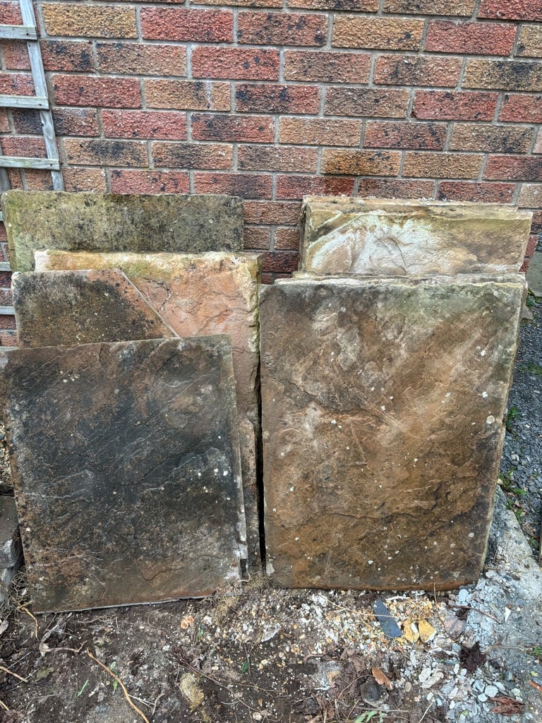 Reclaimed sandstone paving slabs. Approx 23sq metres